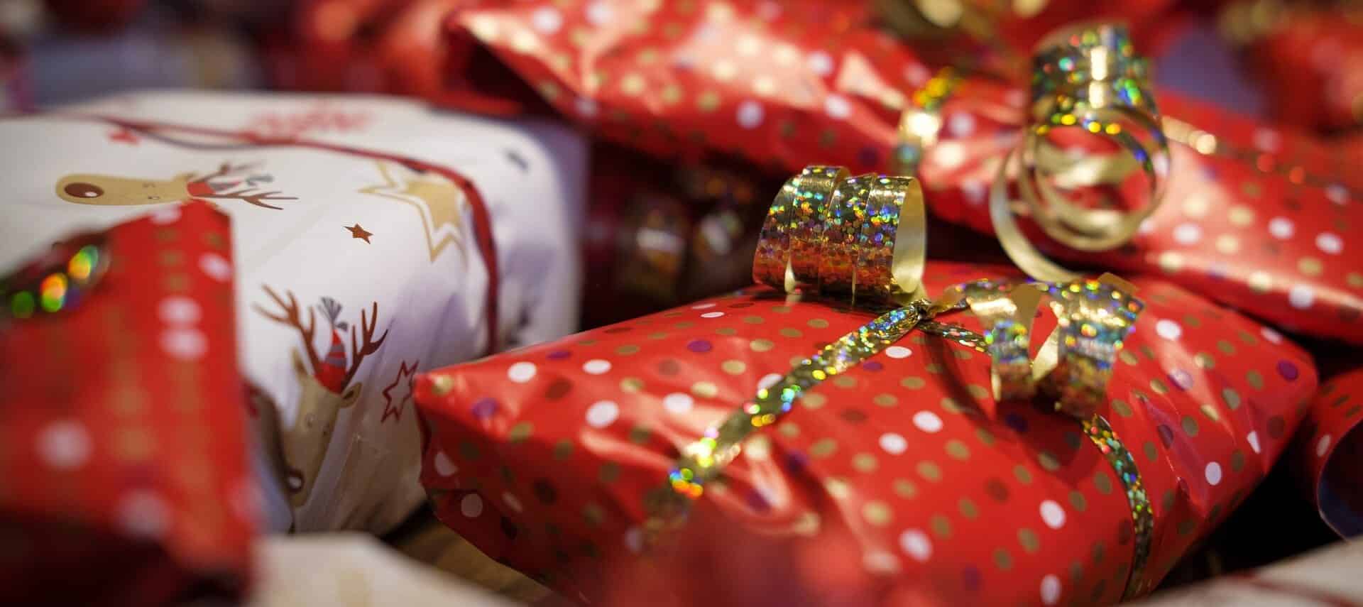 An image showing Christmas presents wrapped with red and white paper.